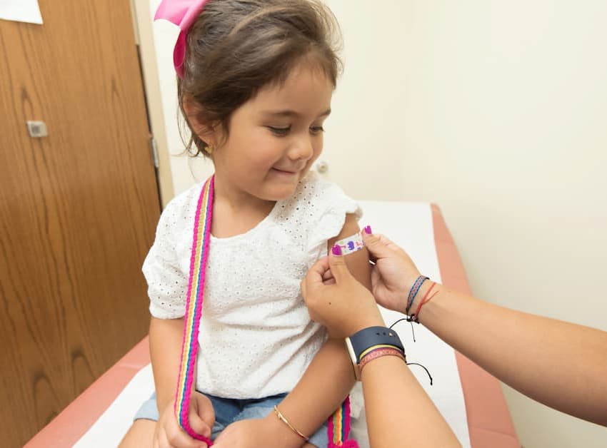 child receiving MMR vaccine
